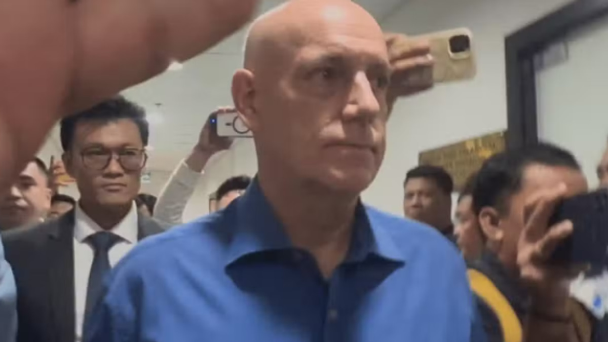 Former Ateneo basketball coach finally appears before Philippine investigators in drowning probe